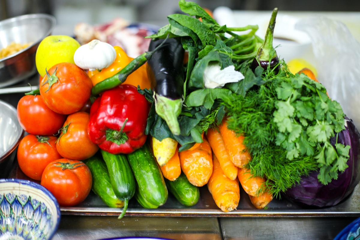 Fresh salad bowl with mixed greens, vegetables, and olive oil drizzle